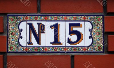 House number tile plaque with floral ornament