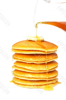 Pouring syrup on the pancakes