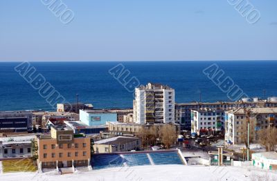 The City on background of the blue ocean The City on background of the blue ocean