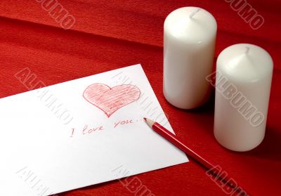 envelope with red heart and two candles