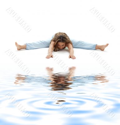 wide-angle seated forward bend on white sand