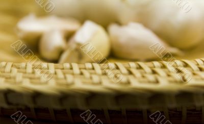 basket and garlics out of focus