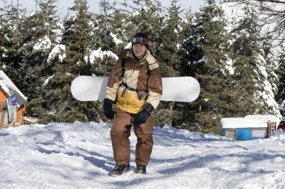 A health lifestyle image of adult snowboarder