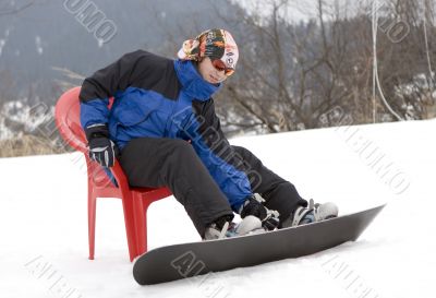 Teens snowboarder in bandanna