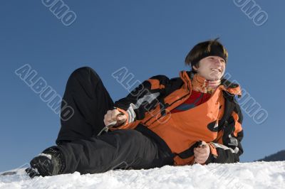 Teenager boy with player in winter mountains