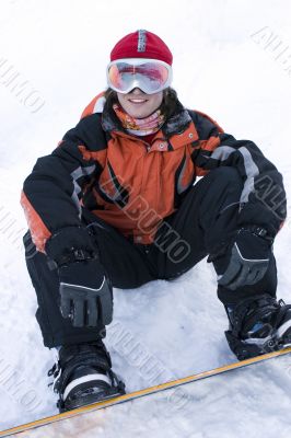 A health lifestyle image of young snowboarder