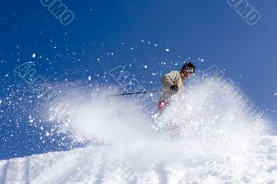 Snow Skier Jumping Against Blue Sky Snow Skier Jumping Against Blue Sky