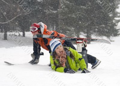 A lifestyle image of two young  snowboarders