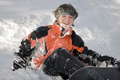 A health lifestyle image of young snowboarder