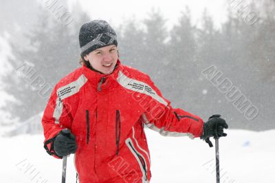 man by mountain skies at snowfall