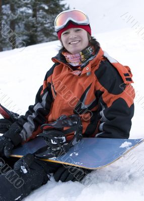 A health lifestyle image of young snowboarder