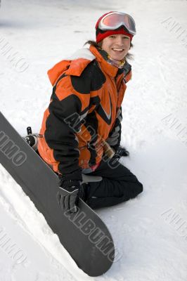 A health lifestyle image of young snowboarder