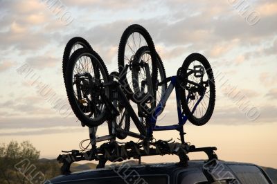 Sports bicycle over jeep