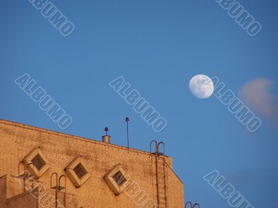 Moon, sky and roof.