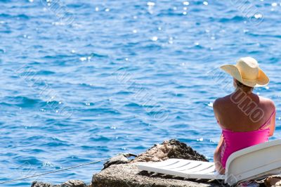 model relaxing on beach