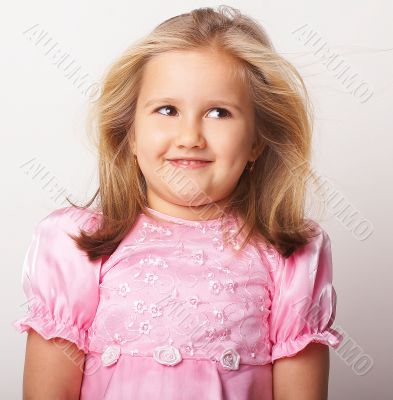 Nice young girl in pink on light background
