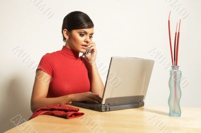 business woman with laptop and phone