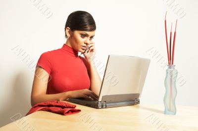 business woman with laptop and phone