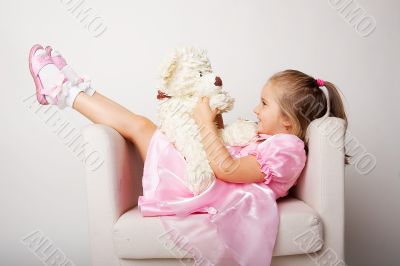 Nice young girl in pink on light background
