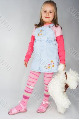 Nice young girl in pink on light background