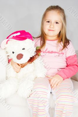 Nice young girl in pink on light background
