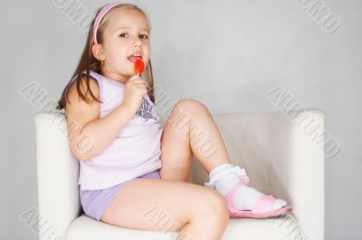Nice young girl in pink on light background