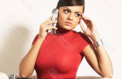 Atractive brunet businesswoman with phone