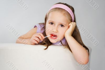 Nice young girl in pink on light background