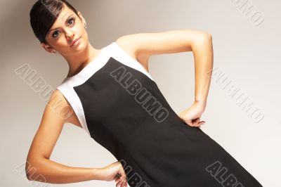 Fashion model Posed on light background in black dress