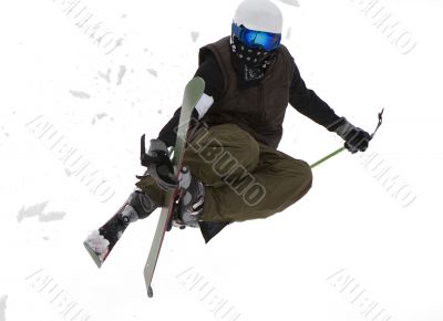 Freestyle. Snow Skier Jumping over white.