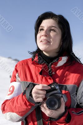 Attractive woman holding a camera