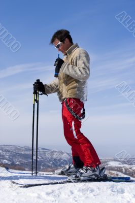Snow Skier with walkietalkie over blue Sky Snow Skier with walkietalkie over blue Sky
