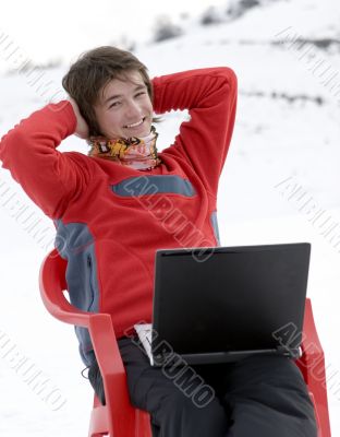 Happy teens student with laptop in winter