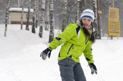 A health lifestyle image of young snowboarder girl