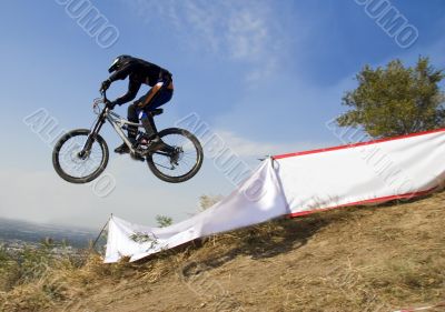 Biker jump in mountains,  Competition