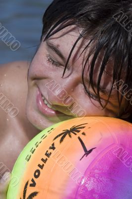 Teenager with ball on the beach Teenager with ball on the beach