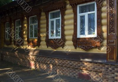 House with carving at windows