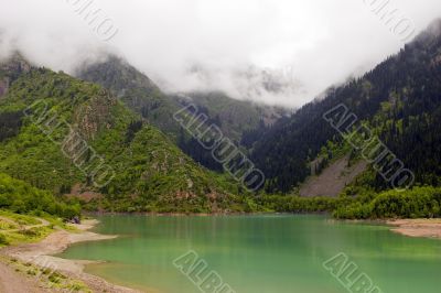 Green lake. Rain. Fog. Green lake. Rain. Fog.