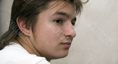 Pensive brown-eyed swarthy European teenager