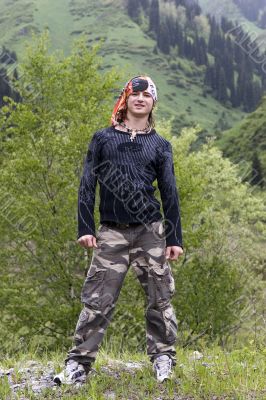 Sport teenager in bandana in summer mountains