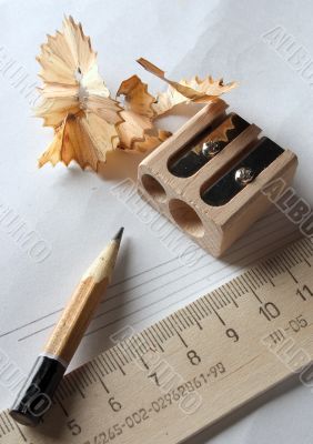 Drafting tools: pencil, paper, ruler and sharpener