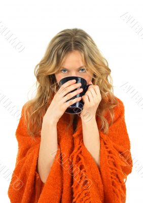 Cozy girl enjoying a cup of tea