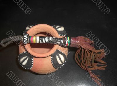 fetish whip above an african ritual incense burner