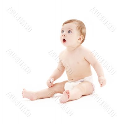 baby boy in diaper with toothbrush