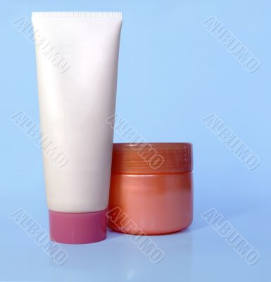 Cosmetic tube and pot of cream