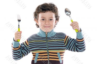Child with a spoon and fork Child with a spoon and fork