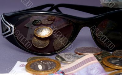 The Spectacles and money. Reflection