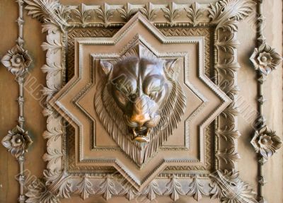 Lion head bas-relief