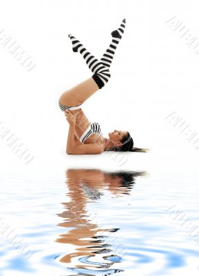 striped underwear shoulderstand on white sand 2