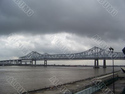 Bridge over river in cloudy weather
